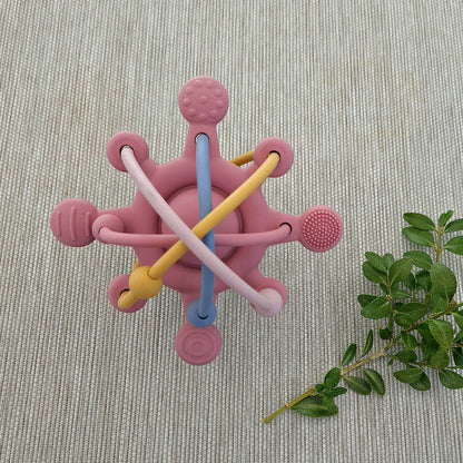 Aktivitetssleke i silikon rosa med platinumherdet silikon og fargerike teksturerte stenger for såre gommer