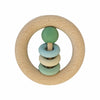 A natural wood baby rattle ringrangle grønn with light green sphere and pastel rings on a central stick