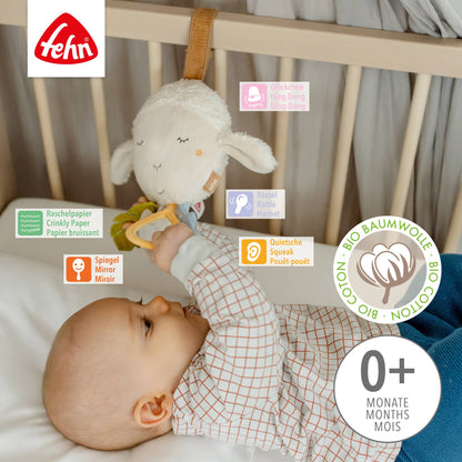 Soft hvit sau aktivitetsleke i økologisk bomull med krøllende papir og speil, plastfri vognleke fra fehn natur